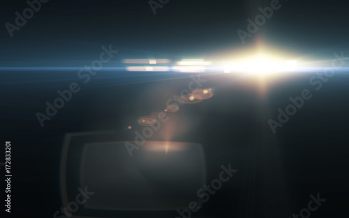 digital lens flare in black background.Beautiful rays of light.Natural flare with dust on space