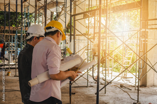 Two engineers working in a construction site