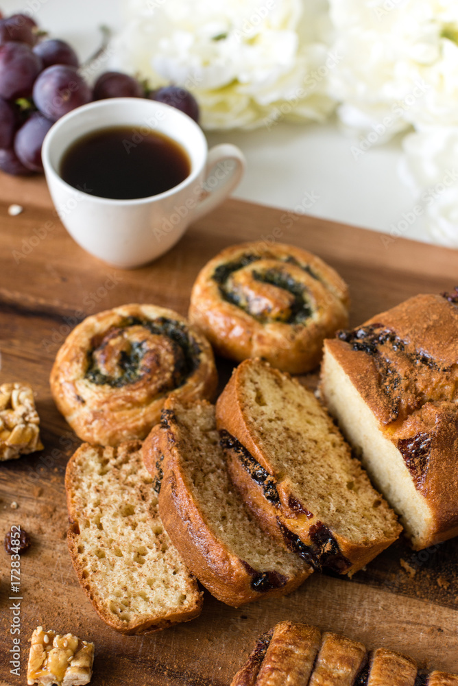 Sliced bread and cup of coffee on the cutting board Sliced bread and cup of coffee on the cutting board