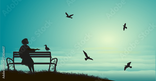 silhouette of girl sitting on the bench near the sea with sun-rise and feed the sea gulls, shadows, memories,
