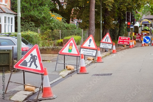 Bilde på lerret roadwork signs line up on a street in small town in the UK, where quality of the