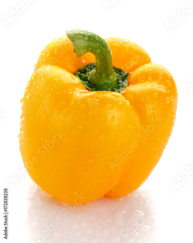 Pepper, food, and vegetable concept - sweet yellow pepper with drops of dew