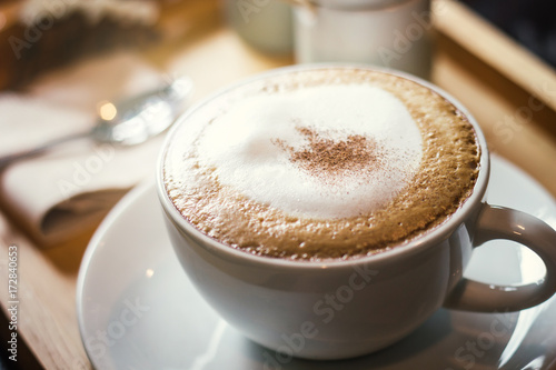 Soft focus on capuccino coffee cup, coffee for background - vintage effect process picture. photo
