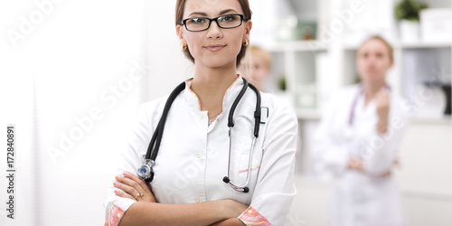 Woman doctor standing at hospital