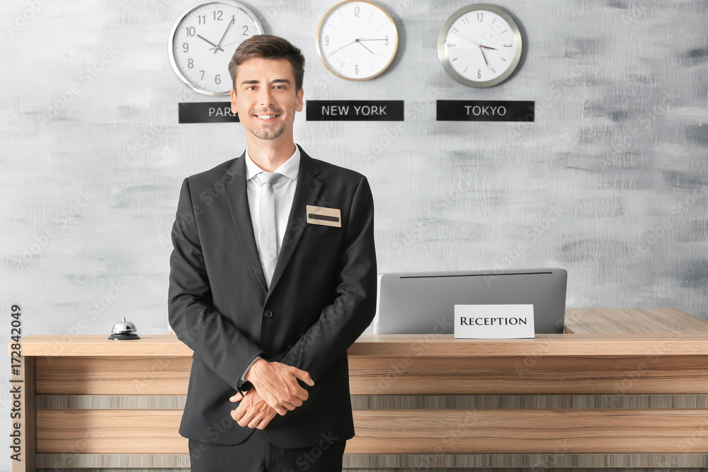 Male Receptionist Working In Hotel Stock Photo Adobe Stock male-receptionist-working-in-hotel-stock-photo-adobe-stock
