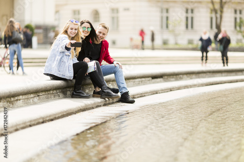 People taking selfie on street in Vienna, Austria