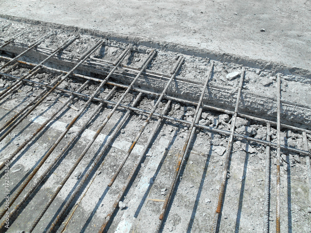 Concrete construction joint at construction site. Wire mesh used to join cast concrete and the new concrete. The join need to do carefully to avoid leakage. 