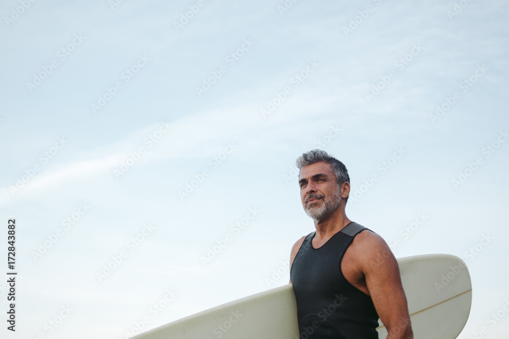 Mature surfer man on the beach Mature surfer man on the beach