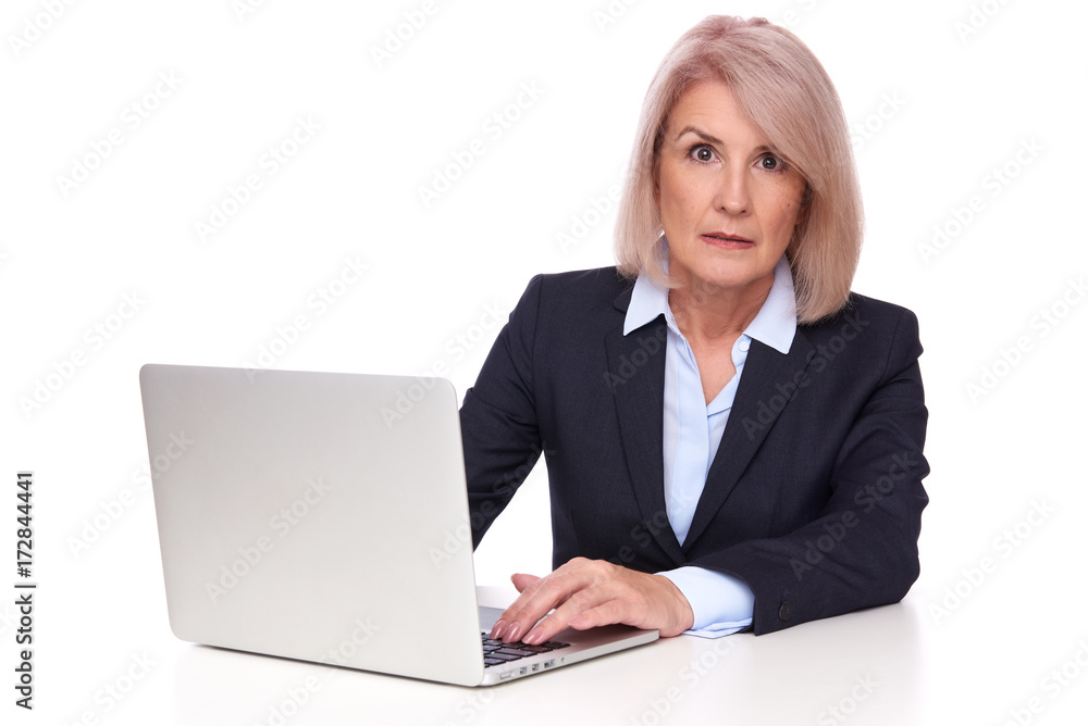 shocked senior businesswoman with laptop shocked senior businesswoman with laptop