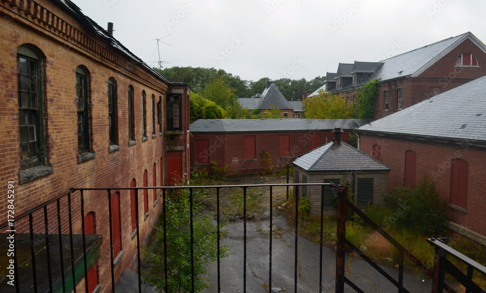 Old abandoned brick hospital building