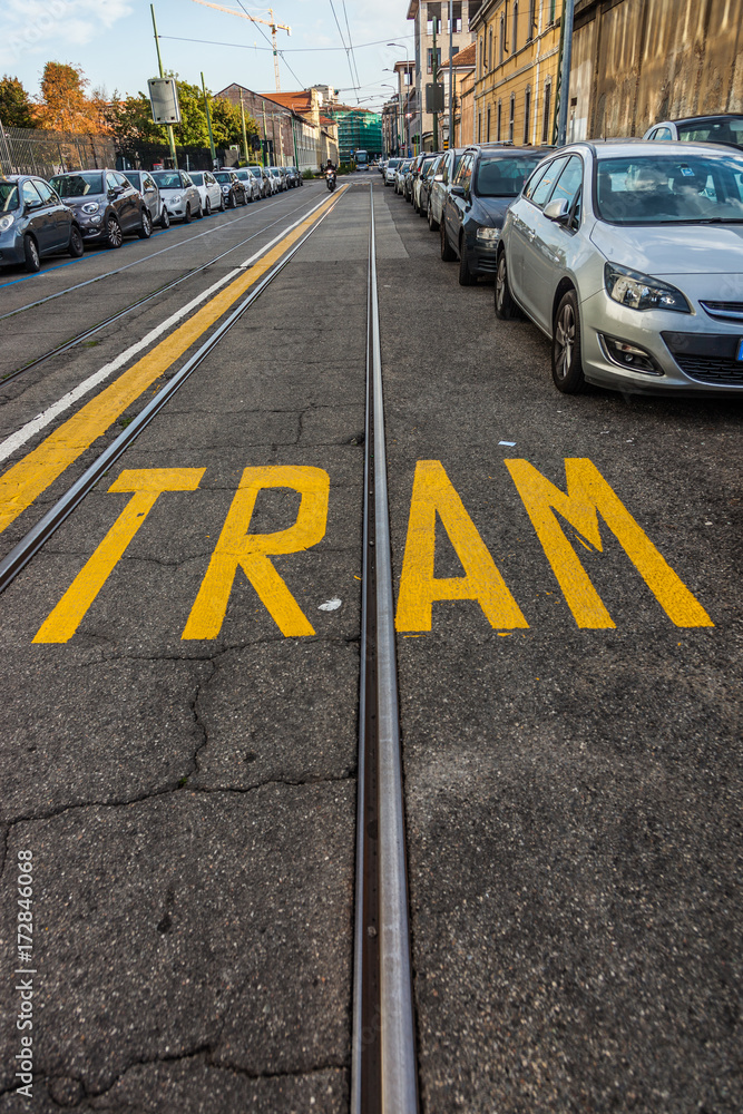 tram rails with yellow writing
