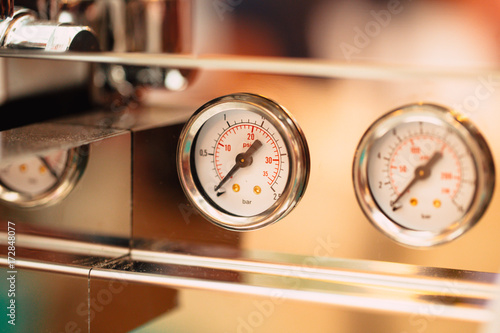 close up pressure gauge pound per square inch (psi) at coffee espresso machine