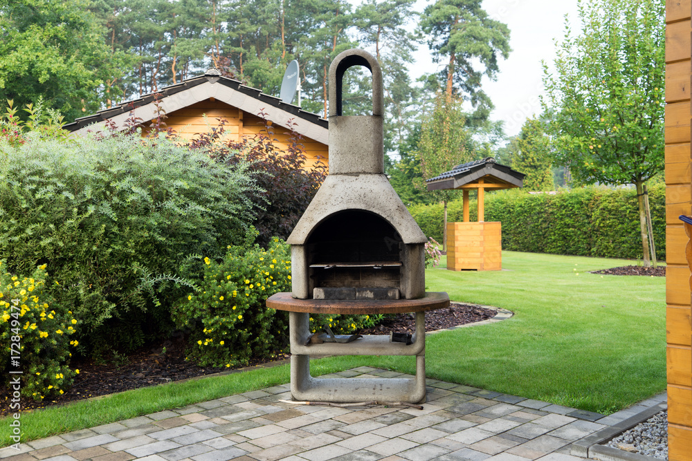Steingrill / großer Grill aus Stein in einem Garten Stock Photo | Adobe  Stock