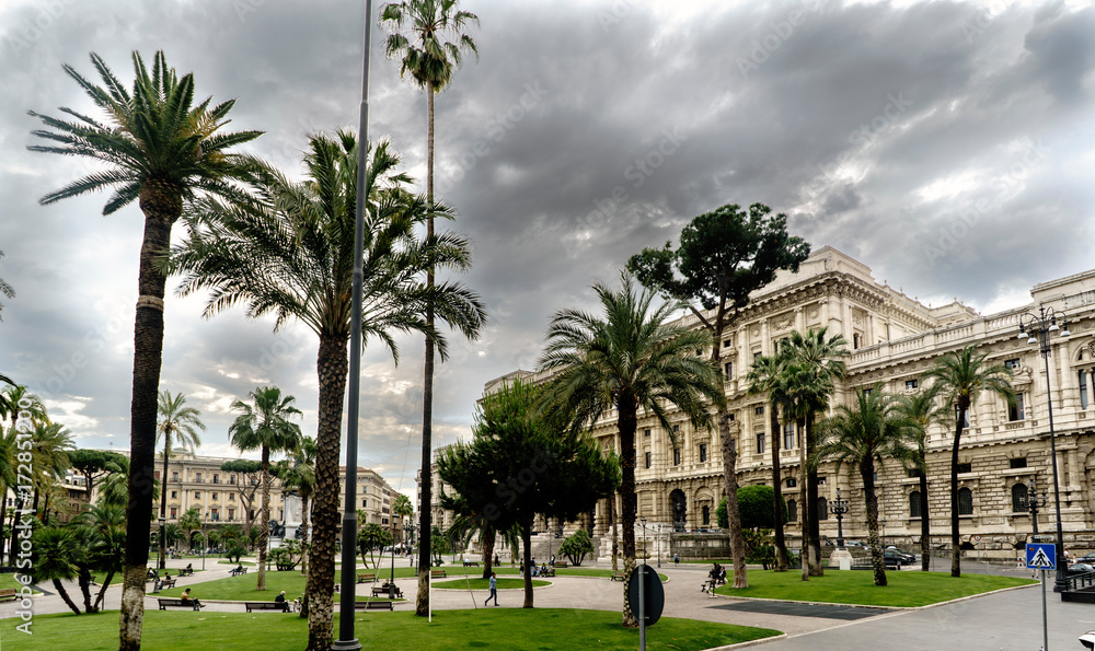 View of Piazza Cavour with the facade of the Supreme Court of Cassation in Rome, Italy. Sky with many dark clouds