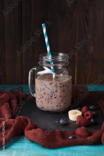 Photo of jar with smoothie on table
