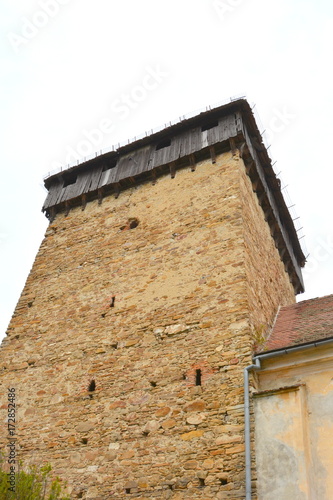 Fortified medieval saxon church in the village Barcut, Bekokten, Brekolten,Transylvania,Romania photo