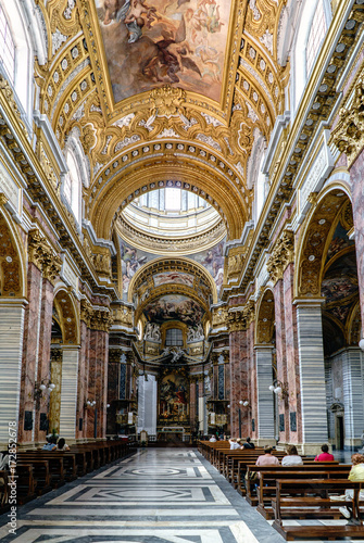 Rome, Lazio, Italy. May 22, 2017: Main nave and main altar of the Catholic church called "Frati Francescani Palatino". Very polychrome and with beautiful frescoes painted on the ceiling