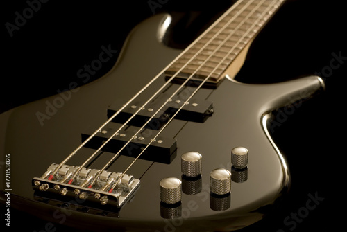 Electric Bass Guitar on Black Background