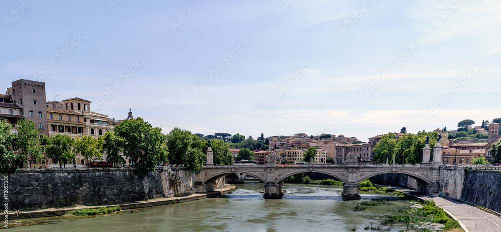 View of the river Arno and the Vittorio Emanuele II bridge, from the bridge of San Angelo. With a magnificent blue sky