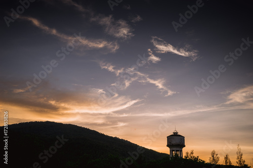 Water tower with sunset.
