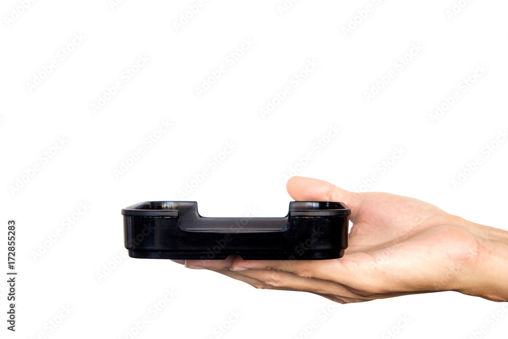 Hand holding black plate isolated on white background. Clipping path. Hand holding black plate isolated on white background. Clipping path.