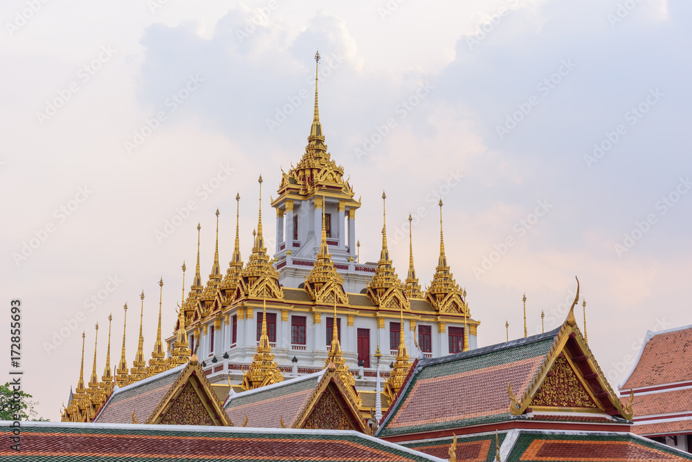 Naklejka premium Golden Castle in public park/Golden pagoda in Wat Ratcha Nadda Temple 