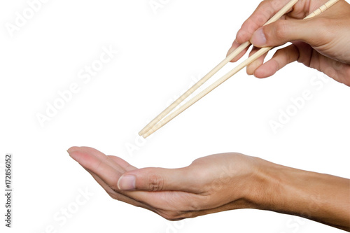 Hand holding chopsticks and open up hand ready to eat isolated on white background. Clipping path.