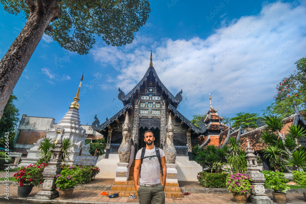 Tourist in Wat Chiang Man temple in Chiang Mai, Thailand.