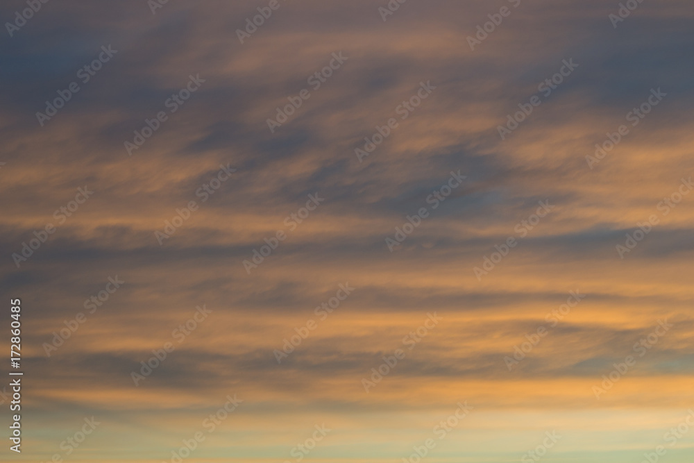 Beautiful photo of big orange clouds after sunset
