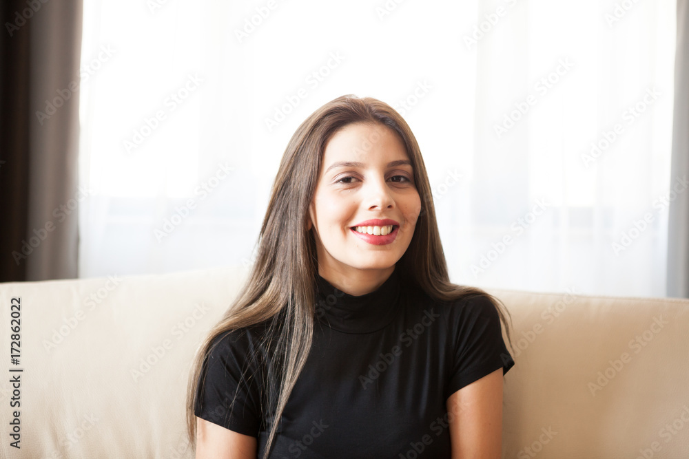 Beautiful gorgeous young woman relaxing in the living room. Having a good time home Beautiful gorgeous young woman relaxing in the living room. Having a good time home