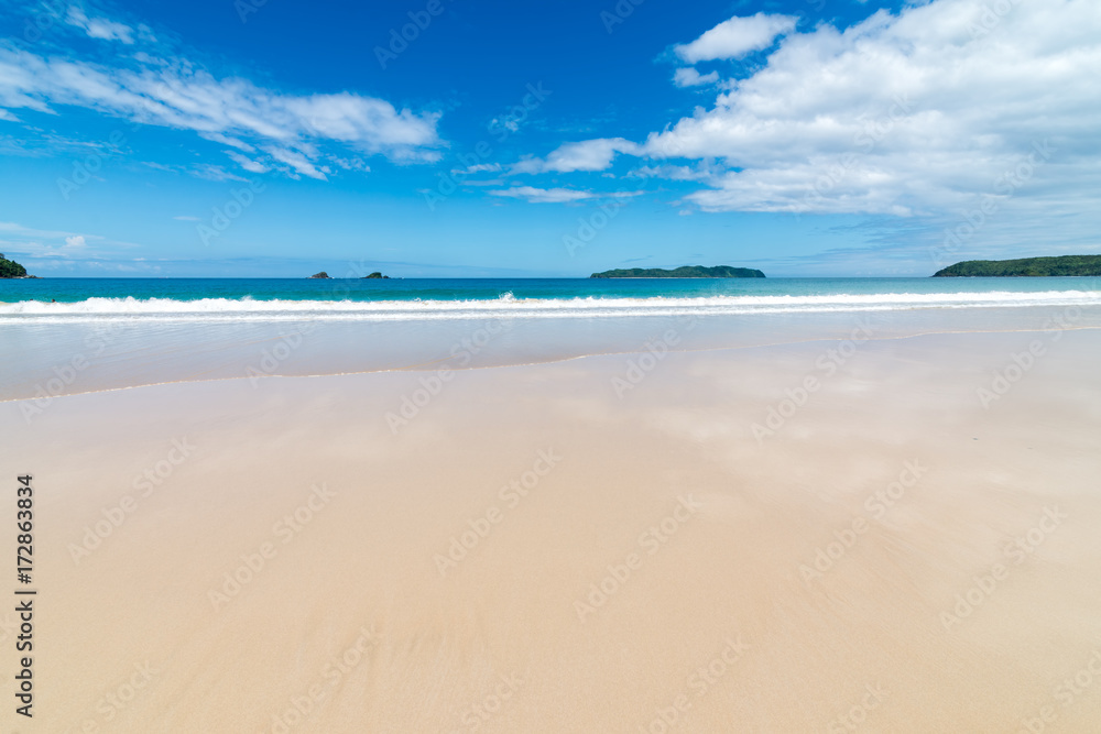 Waves in the sea and sand on the beach. Waves in the sea and sand on the beach.