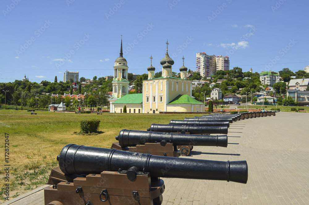 antique ship cannons on the background of the Uspensky (Admiralty) temple. Admiralteysky square, Voronezh city, Russia Federation, 14 Aug 2017