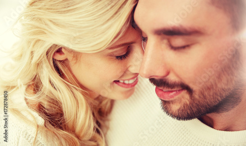 close up of happy couple faces with closed eyes