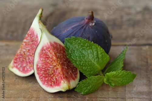 Delicious fresh figs with mint on the table