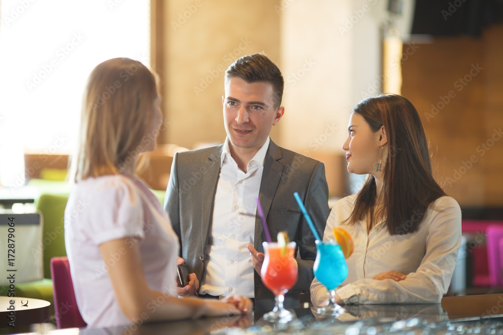 Young buseness people talking in a bar Young buseness people talking in a bar