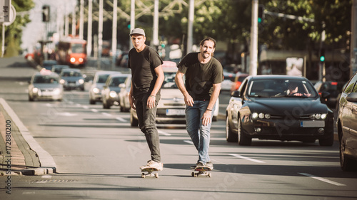 Wallpaper Mural Two skateboarders riding skateboard slope on the city streets Torontodigital.ca