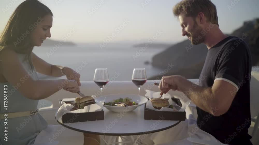 4k travel video dolly move close couple having dinner outside on terrace with burger, salad and red wine
4k travel video dolly move close couple having dinner outside on terrace with burger, salad and red wine
