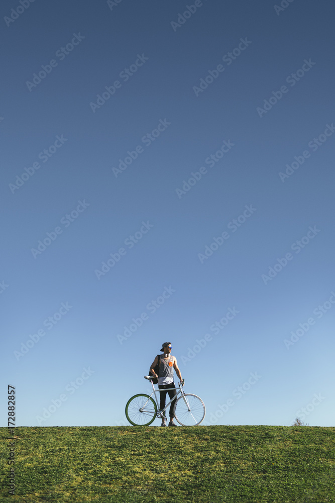 Youn Man Walking Uphill with His Bicycle Youn Man Walking Uphill with His Bicycle