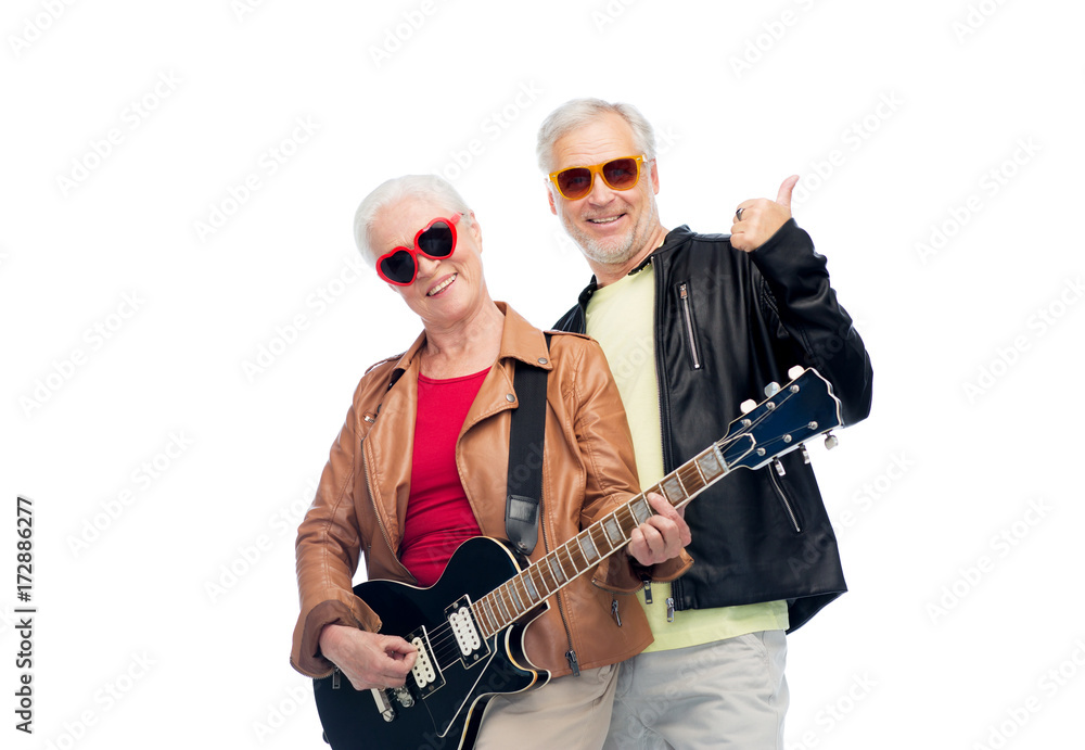 happy senior couple with guitar showing thumbs up happy senior couple with guitar showing thumbs up