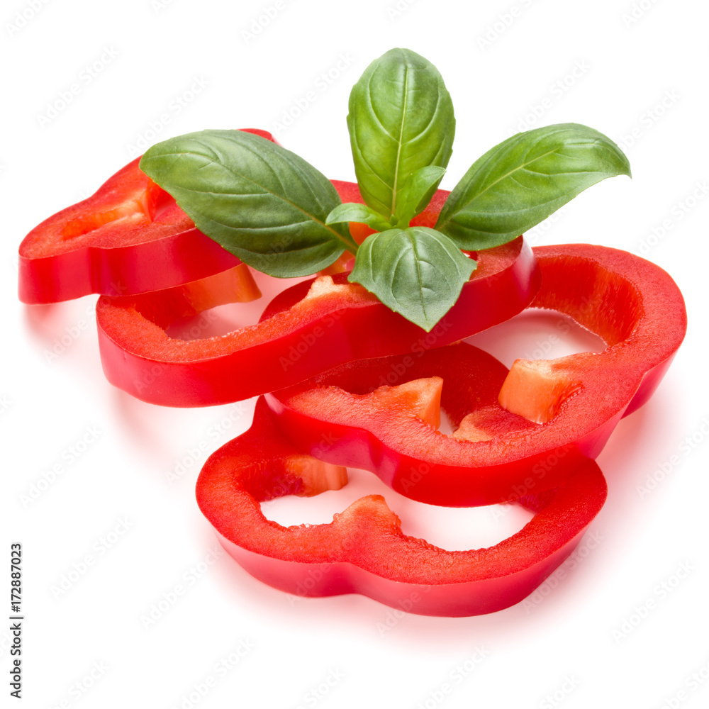Red sweet bell pepper slices and basil leaves isolated on white background cutout Red sweet bell pepper slices and basil leaves isolated on white background cutout