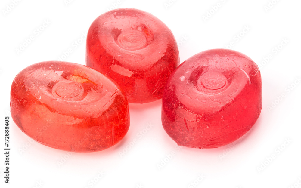 Three colorful fruit hard sugar candies, boiled sweeties or sugar plums isolated on white background cutout Three colorful fruit hard sugar candies, boiled sweeties or sugar plums isolated on white background cutout