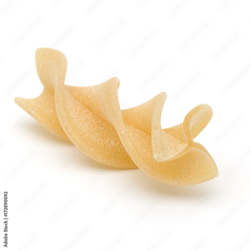 Italian twisted pasta fusilli isolated on white background. Fusilloni, rotini. Italian twisted pasta fusilli isolated on white background. Fusilloni, rotini.