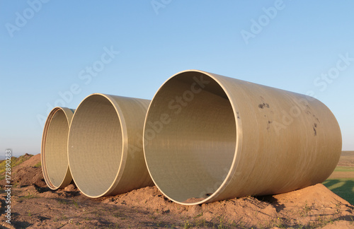 Large concrete pipes waiting for infrastructure work.