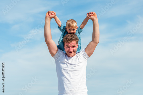 dad and son against the sky