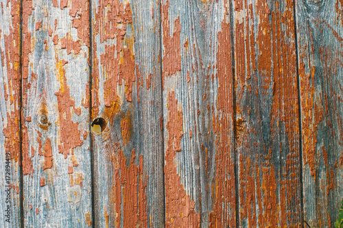 Peeling paint on old wooden rustic material on the wall. Wood texture backgrounds. © De Visu