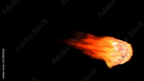 Animated realistic fireball or meteor falling or flying through atmosphere. Black background, mask included.  photo