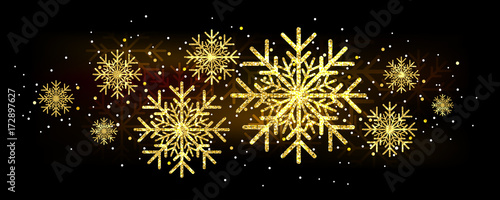 Golden glitter gorgeous snowflake. Luxurious christmas design element with golden glitter snowflake, golden dust and sparkles.
