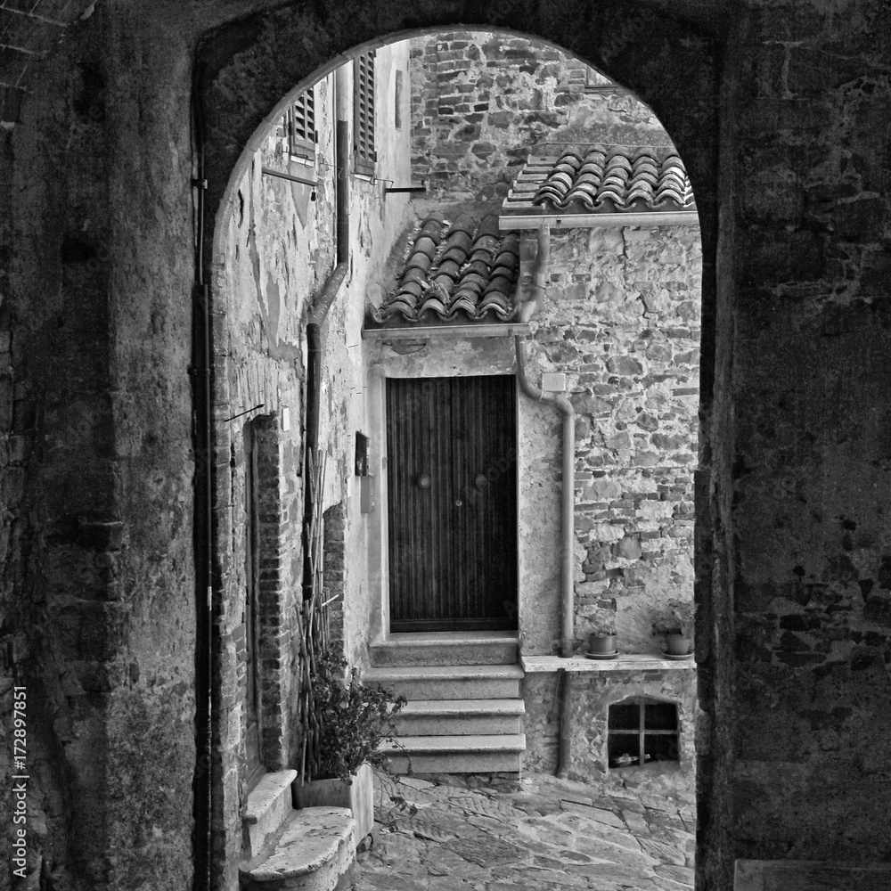 Narrow arch street of medieval italian town