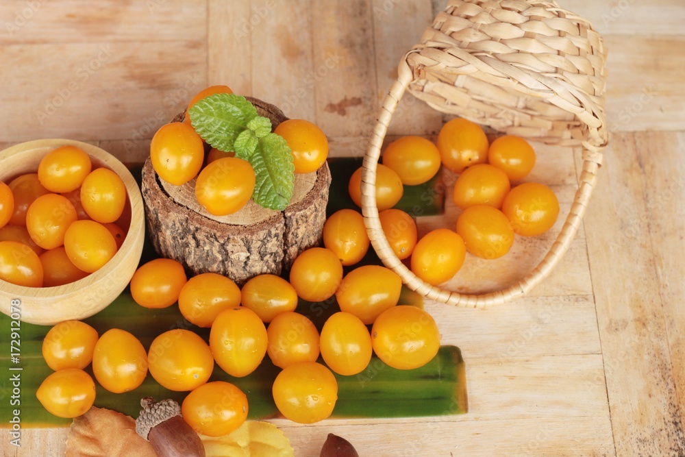 Fresh yellow tomatoes organic on wood background Fresh yellow tomatoes organic on wood background
