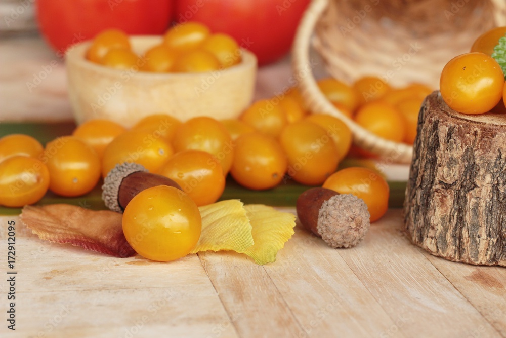 Fresh yellow tomatoes organic on wood background Fresh yellow tomatoes organic on wood background